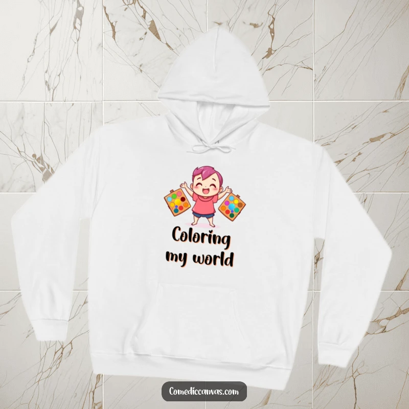 Funny hoodie featuring a happy character juggling art palettes bursting with color, offering cozy comfort for creatives.
