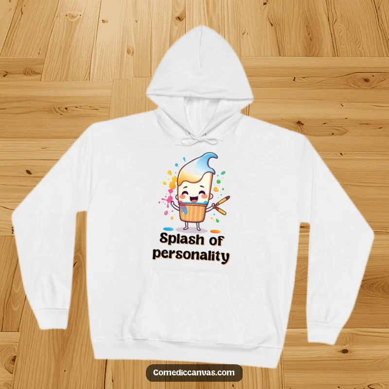 Funny cheerful paintbrush character happily splattering colorful paint, a warm and humorous hoodie for artists.