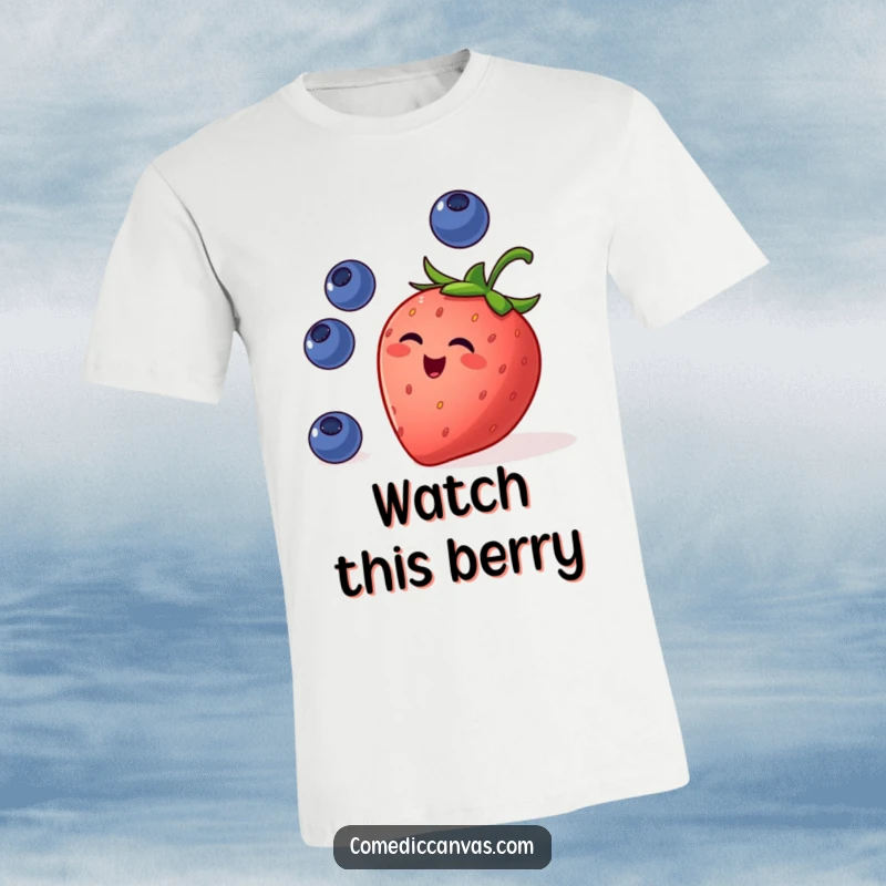 Funny t-shirt featuring a mischievous strawberry juggling small blueberries, showcasing a vibrant and cheerful fruit-themed design.